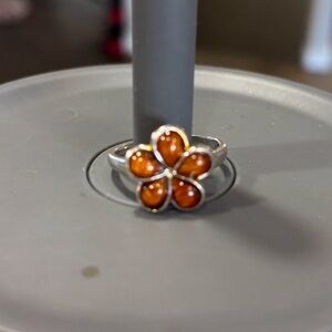 Koa wood flower ring set in sterling silver. Size 8